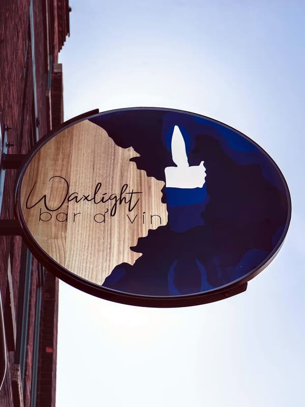 The Waxlight Bar à Vin blade sign on Chandler Street
