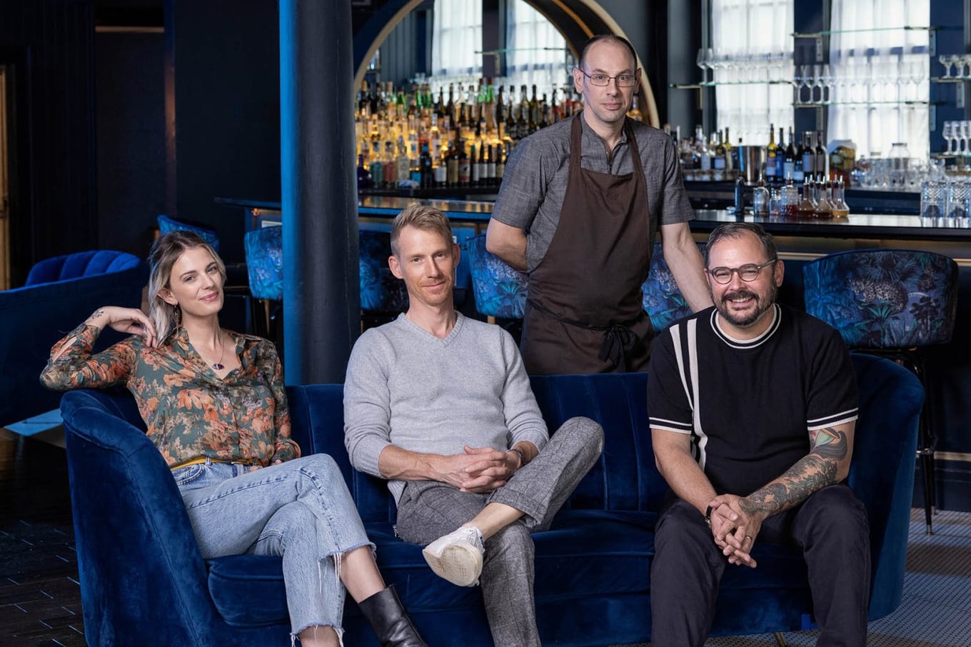The owner-operators of Waxlight Bar à Vin seated in the dining room