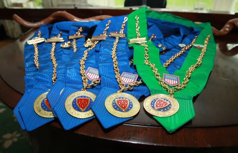 Bailliage collars and medals laid out before the ceremony