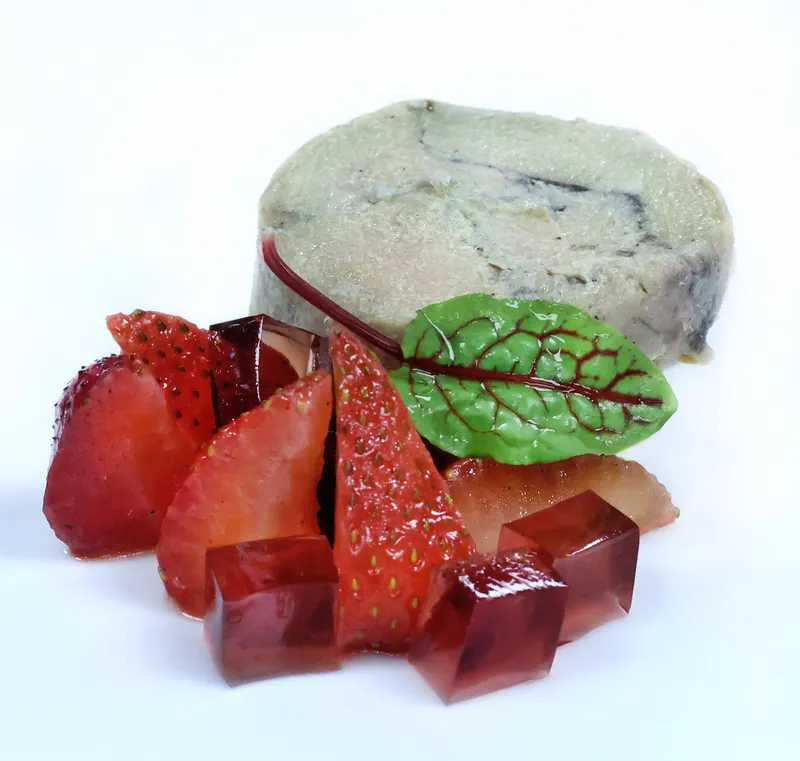 Torchon de foie gras with sliced strawberries and hibiscus gelée