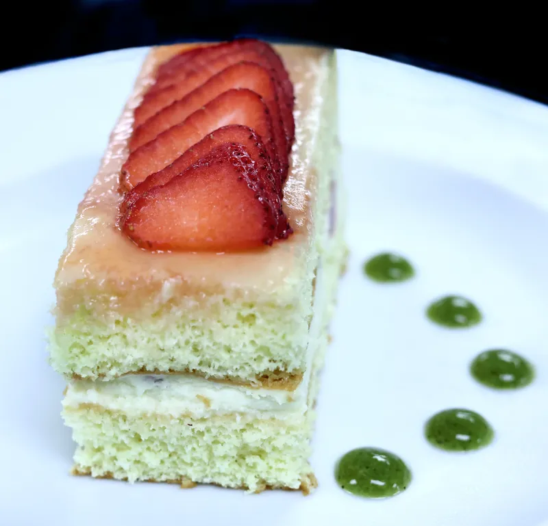 Fraisier cake with sliced strawberries and basil-diplomat dots