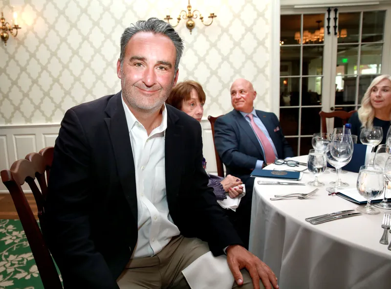 Member seated at his dinner table