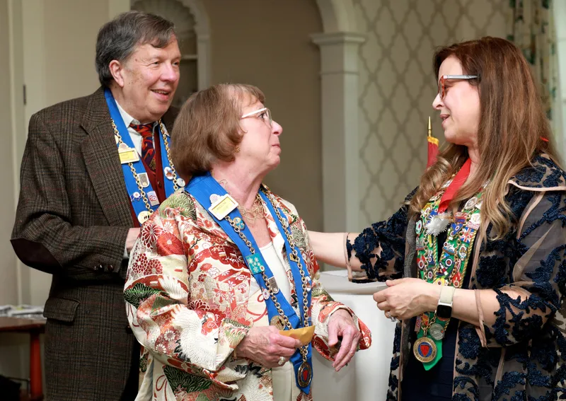 Three members chatting during the reception