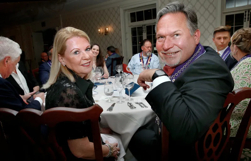 Couple laughing together at their dinner table