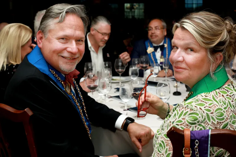 Couple at the dinner table with glasses of wine