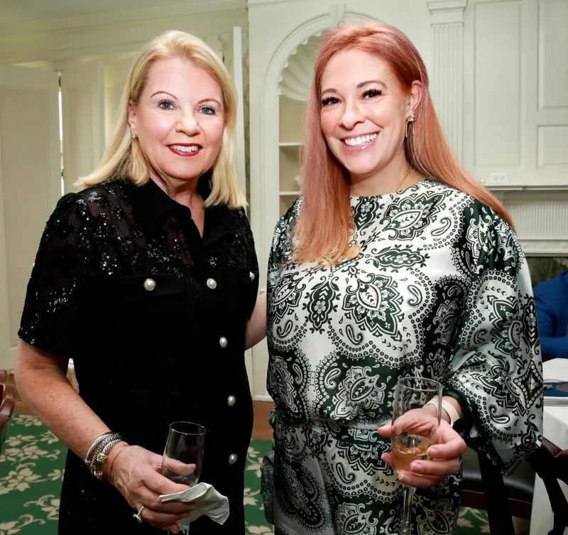 Two members posing together during the reception