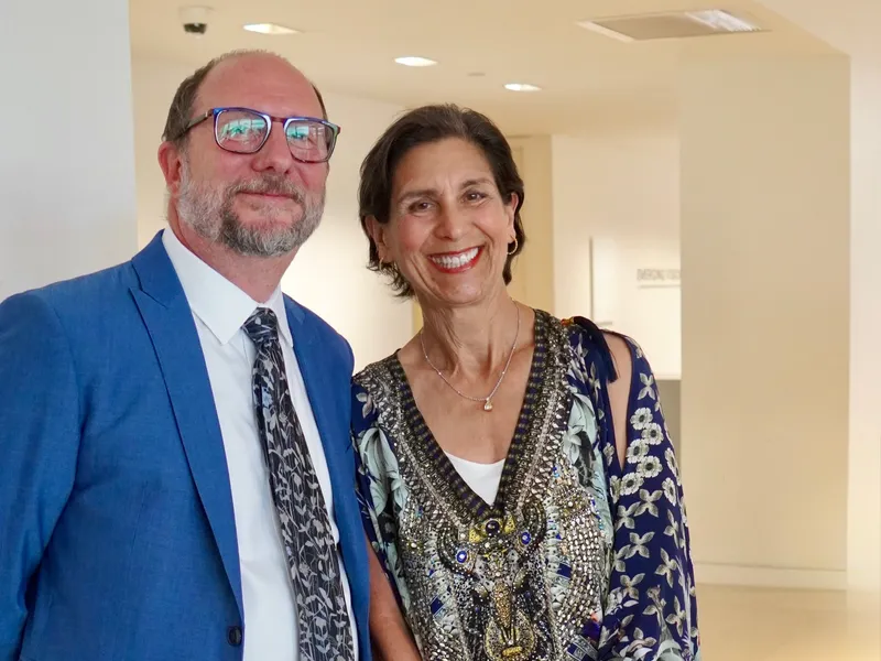 A couple posing together at the reception