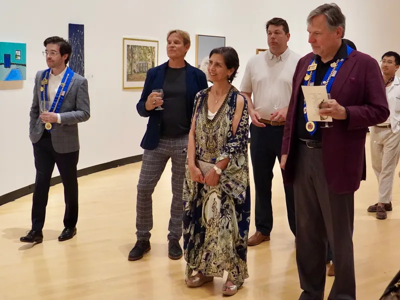 Members touring the auction preview gallery