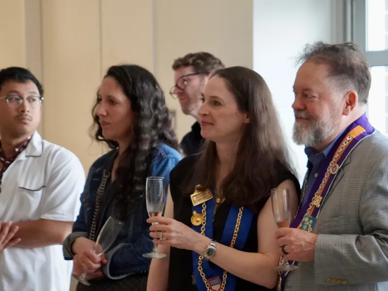 Members listening together during the welcome