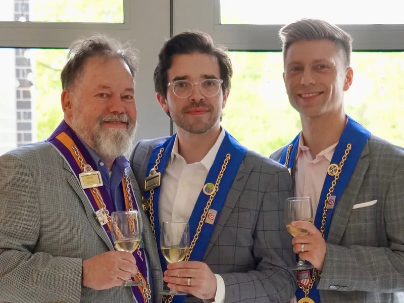 Three officers in their ribbons with glasses of white wine
