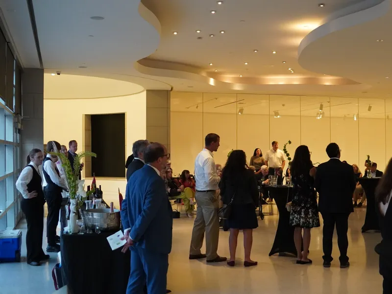 The reception underway in the museum's sculpted-ceiling hall