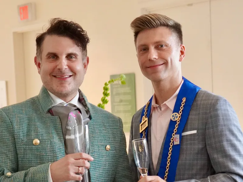 Two members toasting with sparkling wine