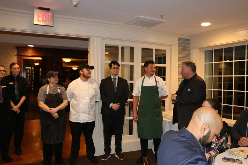 Kitchen and service team presented to diners