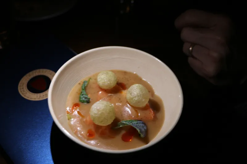 Smoked salmon bisque with pommes soufflés